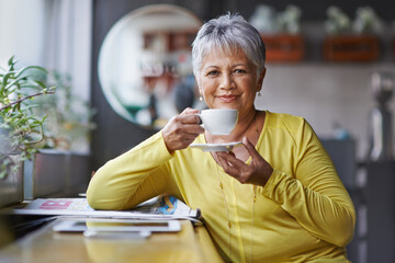 Portrait, tea and mature woman in coffee shop to relax for break, retirement or weekend free time....