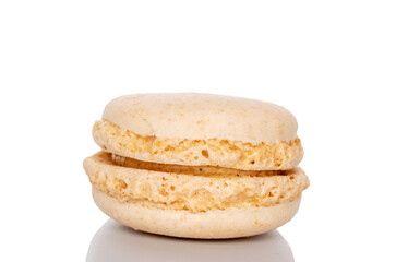 One sweet macaron, macro, isolated on white background.