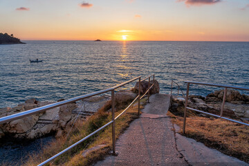 sunset in Rovinj Riva with the adriatic sea and stone stairs