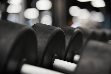 close-up of a dumbbell in a gym, selective focus on the handle