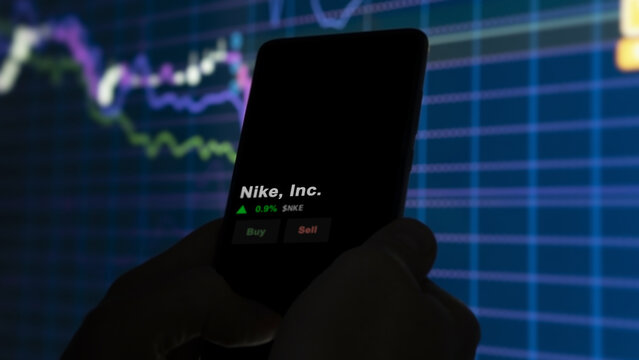 March 12th 2024 Washington County, Oregon. The logo of Nike, Inc. on the screen of an exchange. Nike, Inc  price stocks, $NKE on a device.