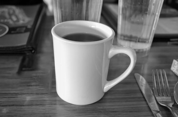 cup of coffee on wooden table