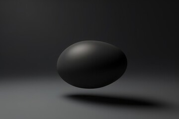A dark grey graphite object floating in the air