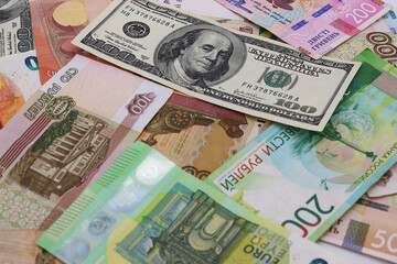 Obraz premium Image of banknotes on the table of different countries.