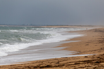 Fototapeta na wymiar waves on the beach in the morning