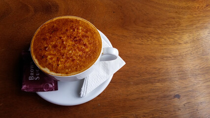 a glass of coffee with caramelized sugar