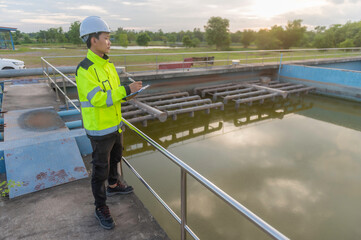 Environmental engineers work at wastewater treatment plants,Water supply engineering working at Water recycling plant for reuse