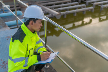 Environmental engineers work at wastewater treatment plants,Water supply engineering working at Water recycling plant for reuse