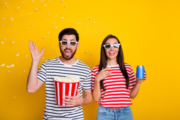 Photo of astonished funky people eat throw air popcorn drink soda watch movie 3d glasses isolated...