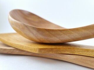 Wooden kitchen utensils on white background