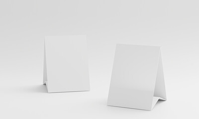 Naklejka premium 3d render Mock up blank white Table Tent isolated on white background. template for designers design presentation, showcase etc, copy space for your logo or graphic design. Paper vertical card