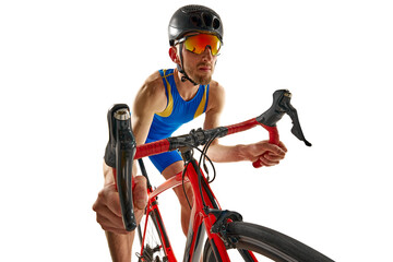 Man, athlete in motion, riding bike, training, competing isolated on white studio background....