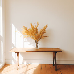 photo of dried goldenrod on wood table or bench in a modern entryway with sunlight creating window pattern on the wall