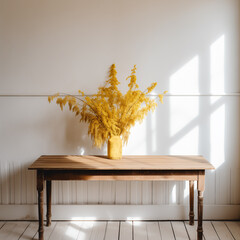 photo of dried goldenrod on wood table or bench in a modern entryway with sunlight creating window pattern on the wall