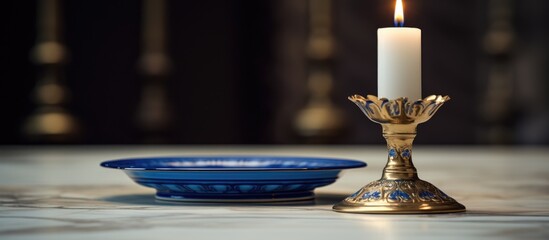 Candlestick with blue candle and gold accent