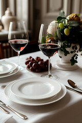 Empty white plate on a table with an elegant setting 