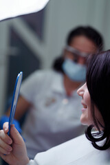 A dentist meticulously works on a patient's teeth using precision instruments, emphasizing the...