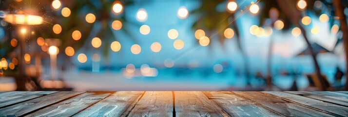 Empty wooden planks table against a blurred background with a sea coast with palm trees and glowing light bulbs in the evening, banner
