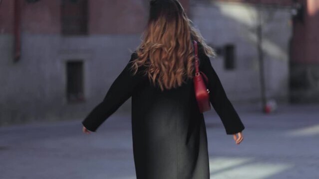 Amazing Girl In A Casual, Elegant Style,  Black Coat, Spins On The Streets Of A Spring City Under Flowering Trees, Cinematic Frame, Dynamics, Movement, Emotional Portrait, Joy, Pleasure, Blooming 