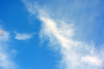 Fototapeta na wymiar Beautiful and unusual nature, bright light blue sky with small white clouds.