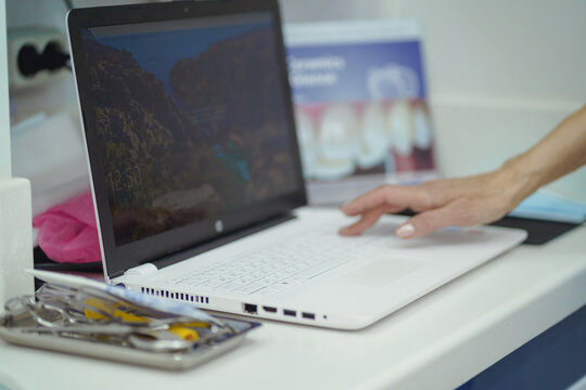 A dental professional engages with a patient, exemplifying the personalized care and attention that is the hallmark of quality dental services.