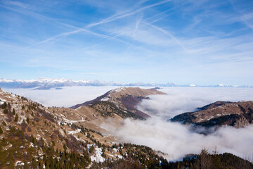 Mountain peaks emerging from the clouds