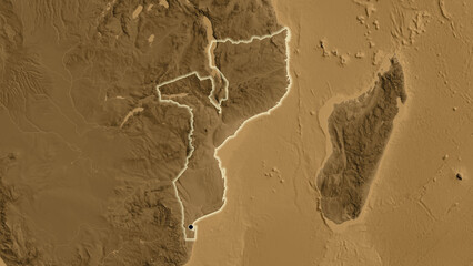Shape of Mozambique. Glowed. Sepia elevation.