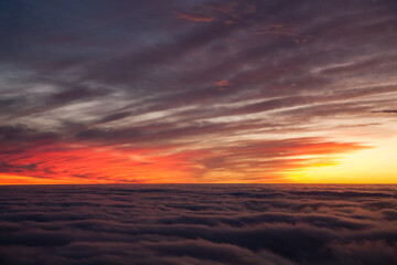 Spectacular sunset over a sea of clouds