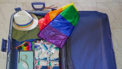 Luggage with rainbow colored accessories is ready to participate in the Gay Pride parade event