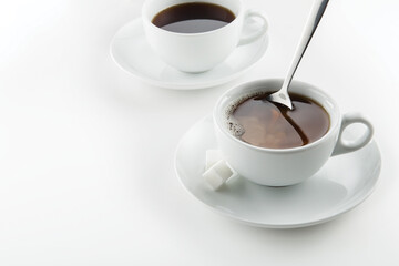 Coffee cups on white surface 