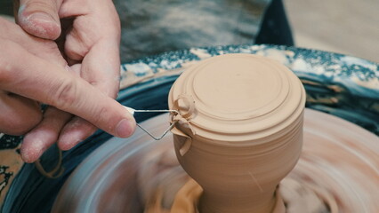 Potter's Hands Shaping Clay on the Wheel
