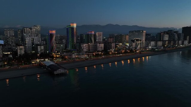 Flying over modern luxury hotel Colosseum Marina on Sherif Khimshiashvili street. Batumi, Georgia 2024 spring