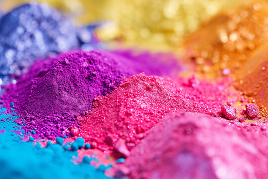 Colorful Indian powder paints, High angle view of multi colored powder paints on table. . Organic Gulal colors for Holi festival, Hindu tradition festive.