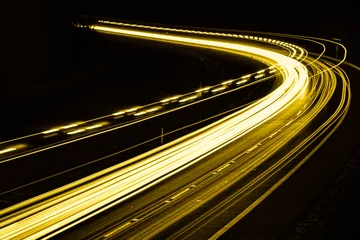 Photo sur Plexiglas Autoroute dans la nuit yellow car lights at night. long exposure