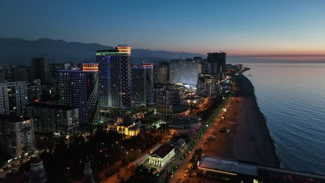 Flying over modern luxury hotel Colosseum Marina on Sherif Khimshiashvili street. Batumi, Georgia 2024 spring