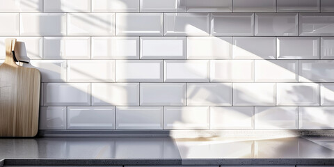 Modern Kitchen Interior with Sunlight Casting Shadows on White Tiles