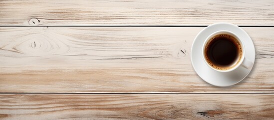 Cozy Coffee Cup Resting on Rustic Wooden Table in Warm and Inviting Cafe Setting