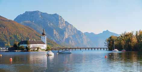 Fototapeta na wymiar lake Traunsee and Ort castle with footbridge to the island, austrian landscape Gmunden