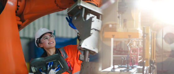 Professional engineer women, worker, mechanical, maintenance, engineering women training. Engineer woman worker work design program machine robotic arm in automation factory industry.