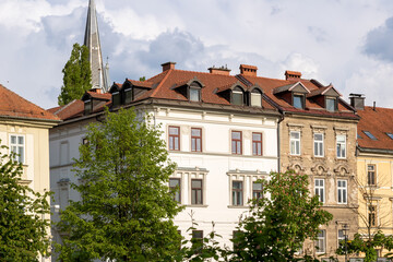 Beautiful buildings along the promenade of the navigable Ljubljanica river in the city center of...