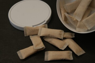 Light brown nicotine pads in the package. High quality photo
