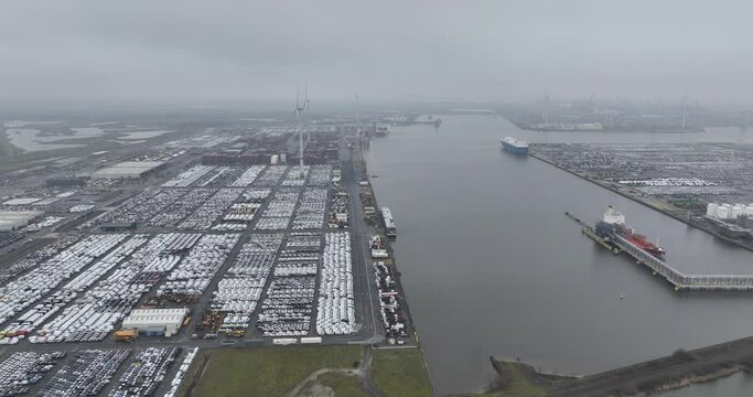 Antwerp Euroterminal is the largest multipurpose terminal in the port of Antwerp. Transportation of cars, mobility industry. Global logistics over sea. Cars, trucks, and other goods.
