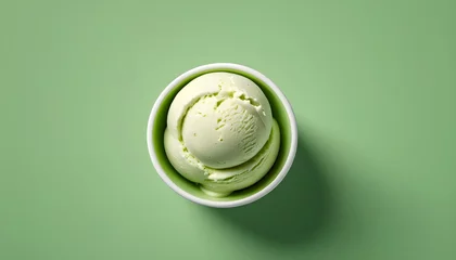 Foto auf Alu-Dibond One rounded scoop pista ice cream white bowl, top view on green background, photorealistic no cone © Xabi