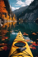 A bright yellow kayak floating on calm water. Perfect for outdoor activities - obrazy, fototapety, plakaty