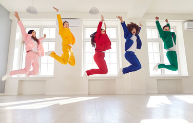 Dancing high jump group people, cool happy dance entertainment, office party gathering, bright formal suit. Young cute disco team, color suit set wear, express enjoyment, event celebration performance