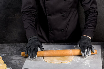 Preparation of the dough. Rolling out the dough with a wooden rolling pin