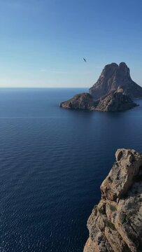 The island of Es Vedra and Pirates Tower. Vertical video.
