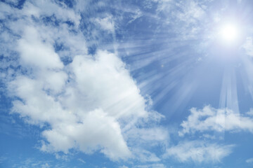 Naklejka na ściany i meble Bright sun shining in clouds