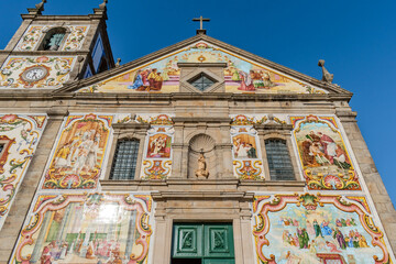 Detail of the facade of the Our Lady of Amparo church with colorful tiles with biblical figurative themes, Válega - Aveiro PORTUGAL