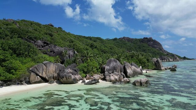 Anse Cocs beach, La Digue Seychelles, tropical beach during a luxury vacation in Seychelles. Tropical beach Anse Cocs beach, La Digue, Praslin, Mahe Seychelles with turqouse colored ocean